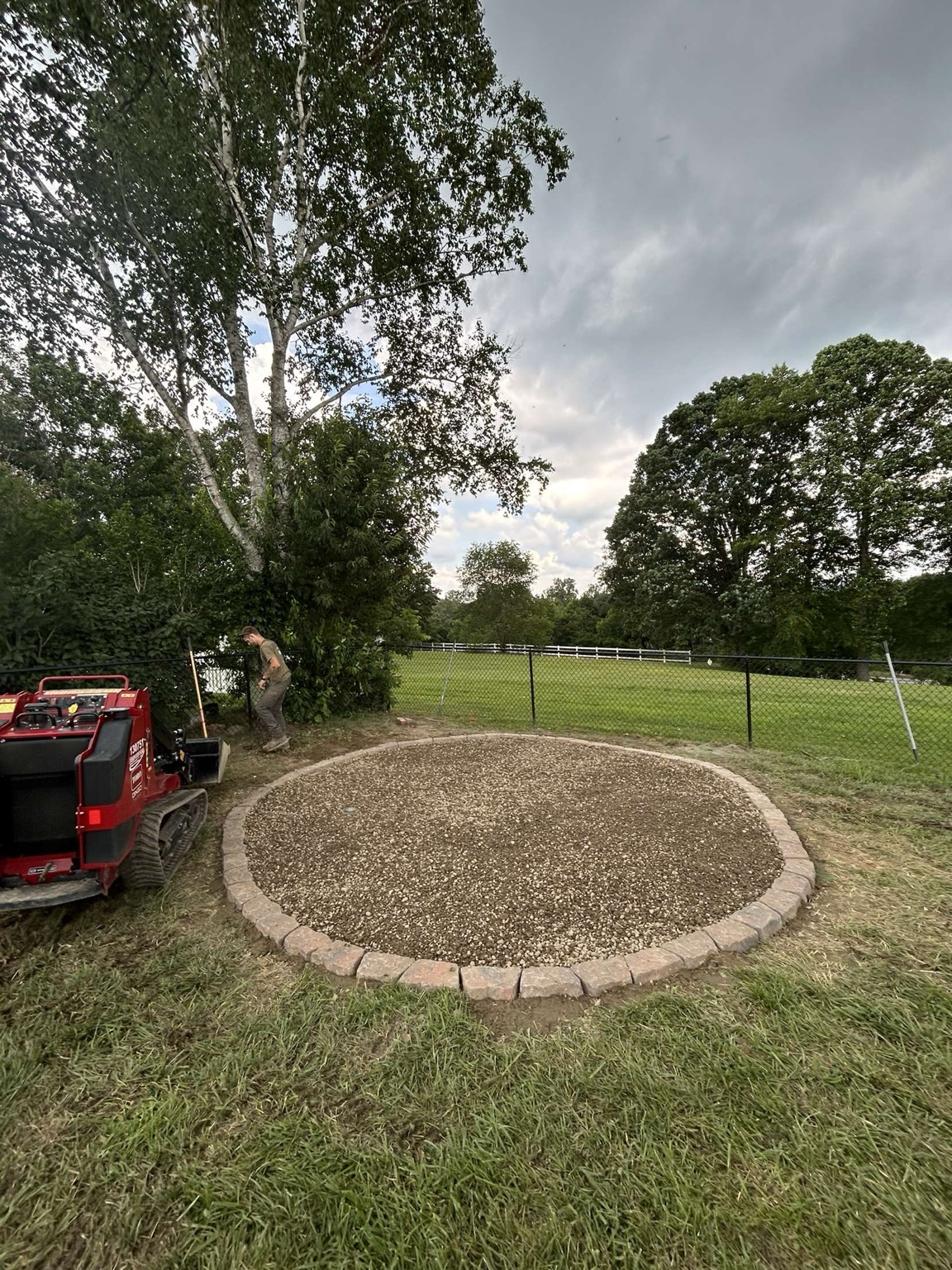 Stone edged fire pit gravel base
